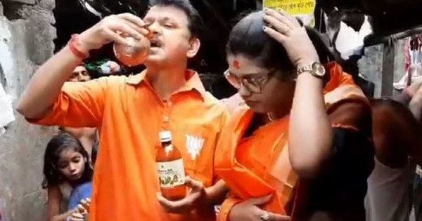 코로나19 바이러스를 예방한다며 소 오줌을 마시고 있는 인도인들.